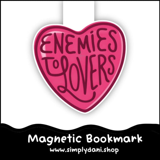 Heart-shaped magnetic bookmark with 'Enemies to Lovers' text on a white background