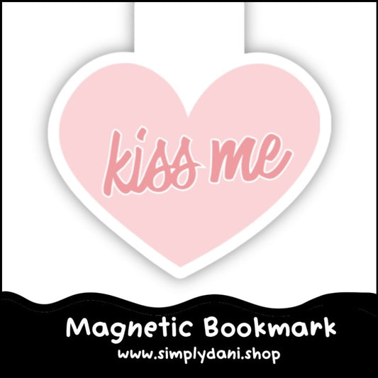 Heart-shaped pink magnetic bookmark with 'kiss me' text on a white background